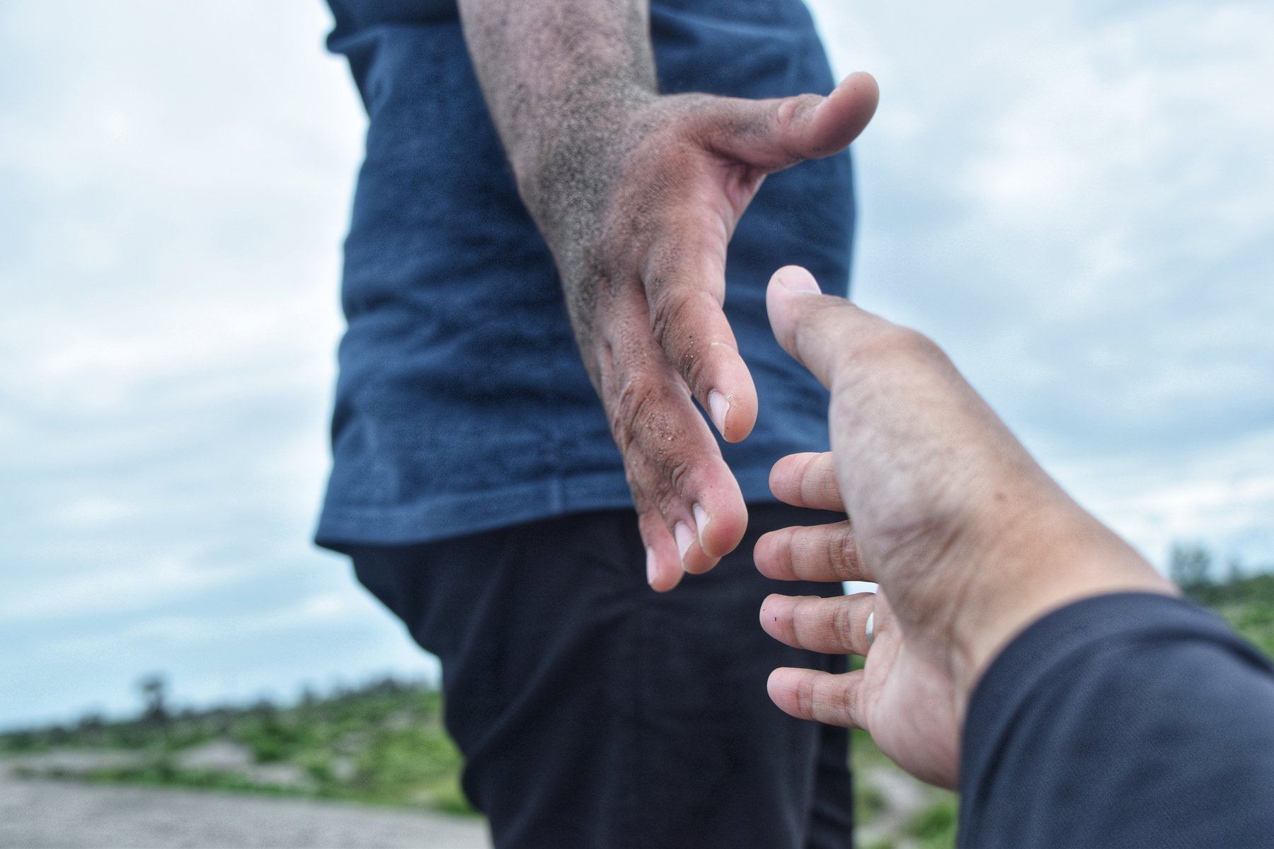 Grabbing hands to help each other